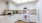 a kitchen with white cabinets