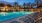 a swimming pool with chairs around it