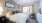 a bedroom with a bed and a chair