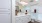 a bathroom with white cabinets