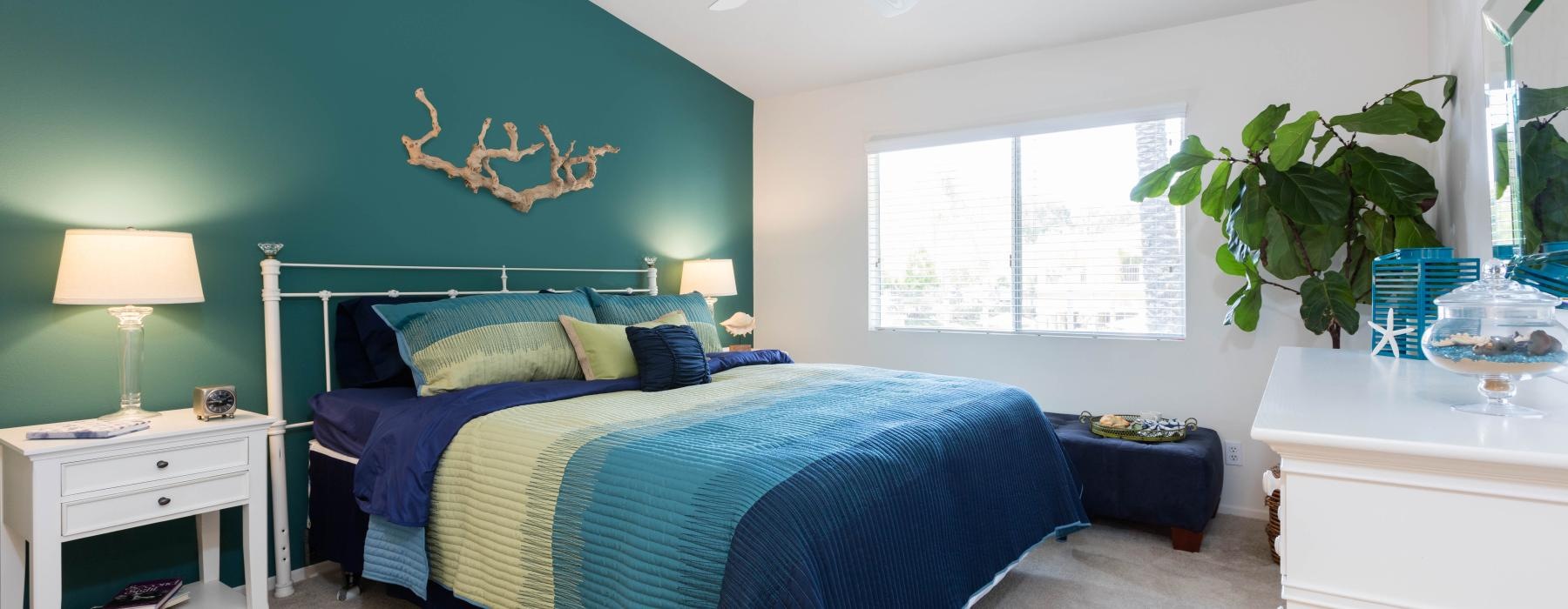a bedroom with a blue bed