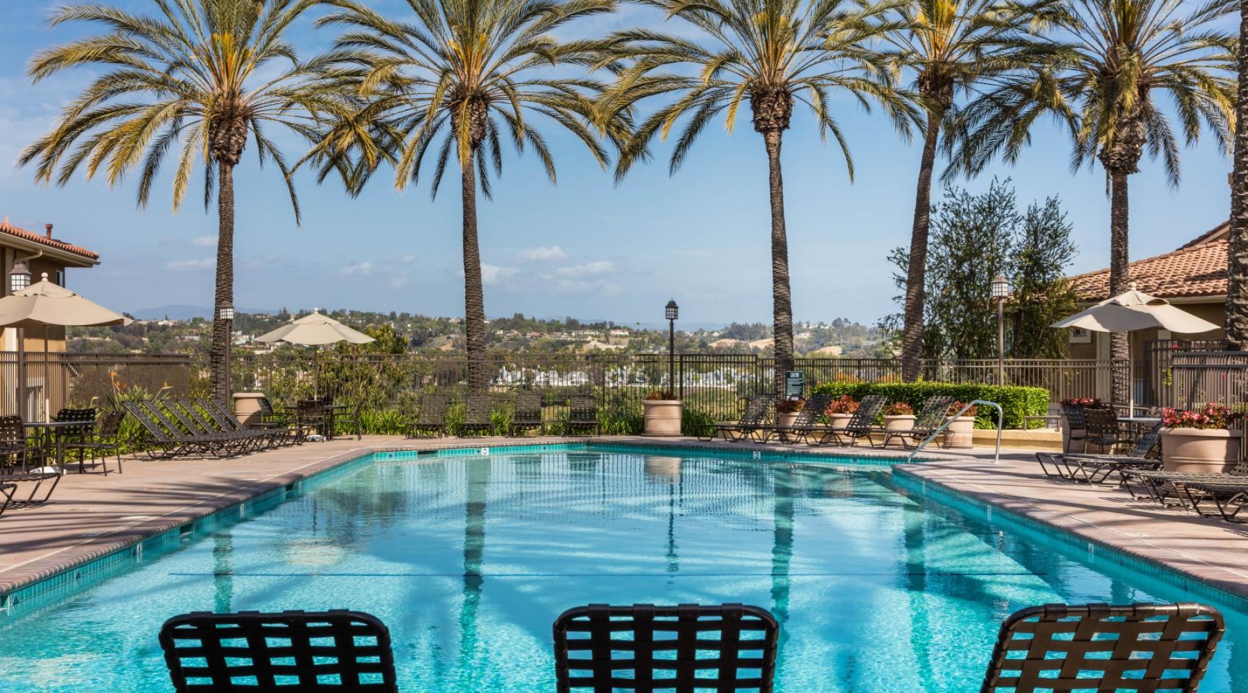 a pool with chairs around it