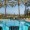 a pool with chairs around it