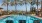 a pool with chairs around it