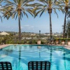 a pool with chairs around it
