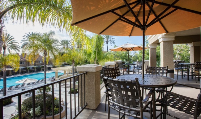 patio with umbrellas with view of a pool