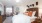 a bedroom with a bed and a fan