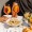 a dinner table with food and people holding drinks