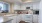 a kitchen with white cabinets