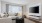 a living room with a tv and couches