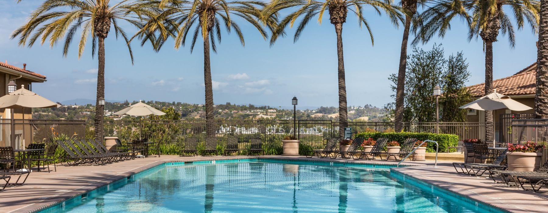 a pool with chairs around it