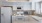a kitchen with white cabinets
